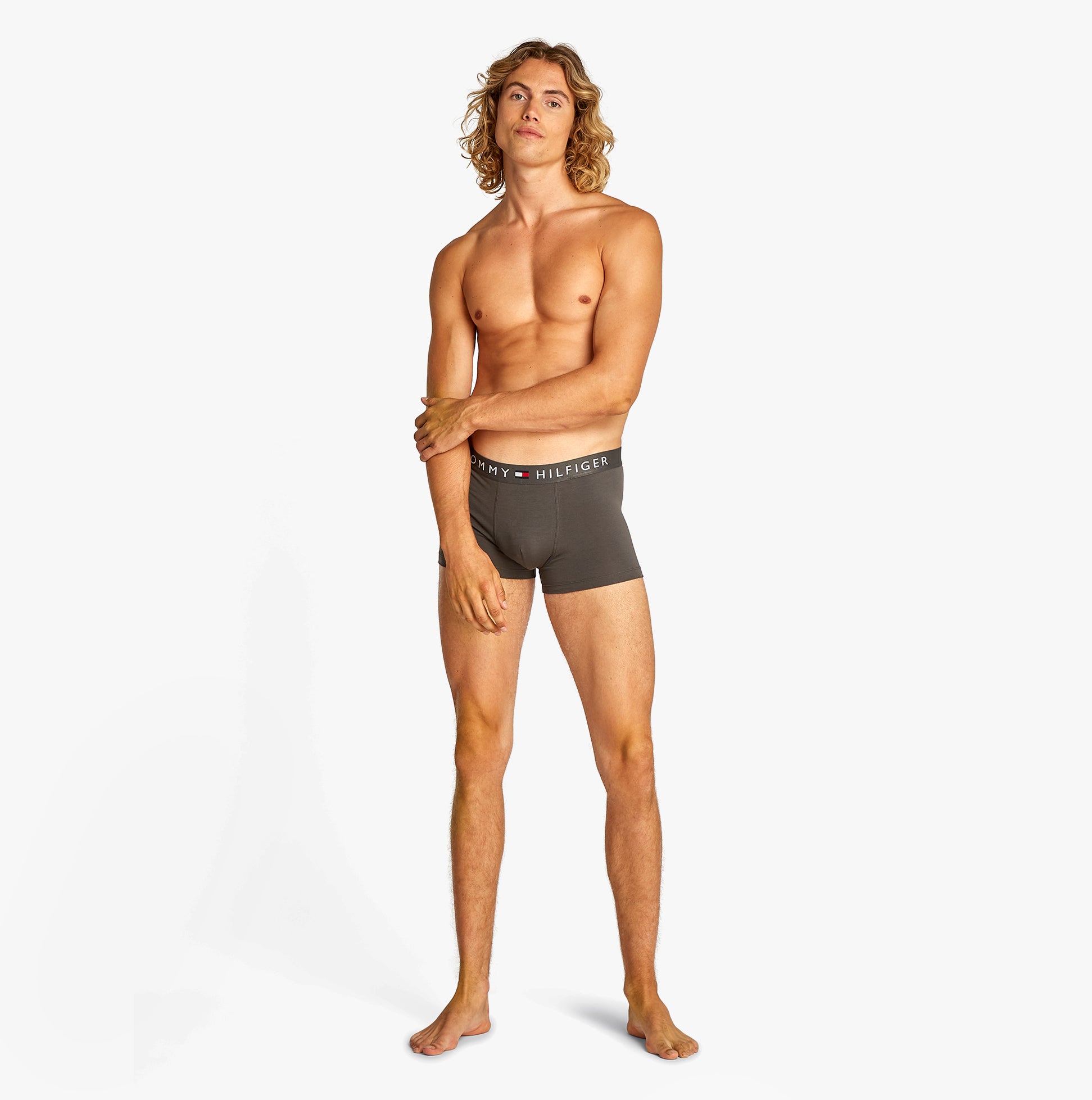 Tommy Hilfiger TH ORIGINAL Mens 3 Pack Trunks Multicoloured side view on model, showcasing stretch cotton and logo waistband.