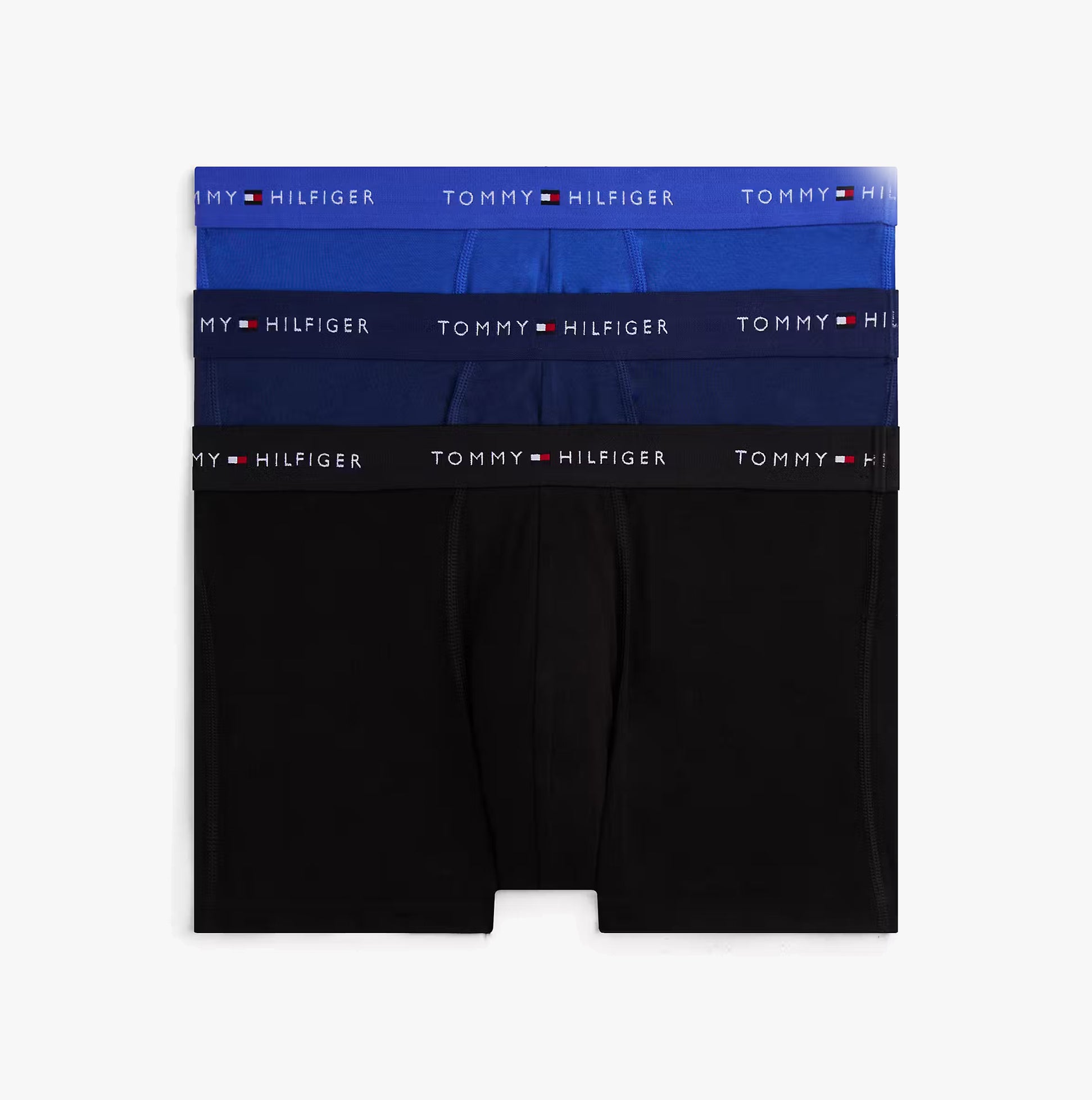 Tommy Hilfiger Mens 3 Pack Logo Waistband Cotton Trunks Multi front view showing three color options: blue, dark blue, and black.