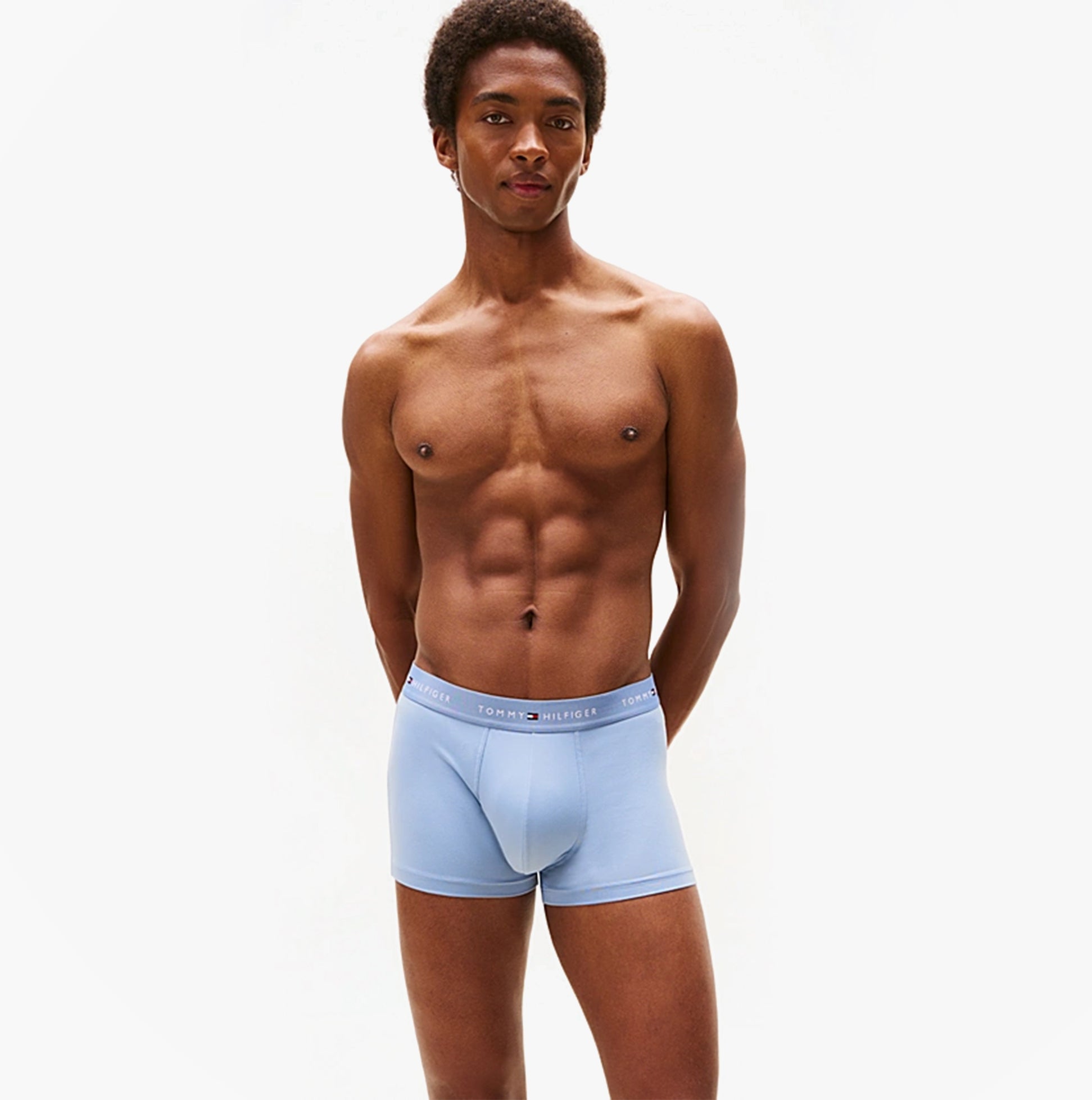 Tommy Hilfiger 3-Pack Signature Mens Microfibre Trunks Multicoloured front view on model showcasing light blue design.