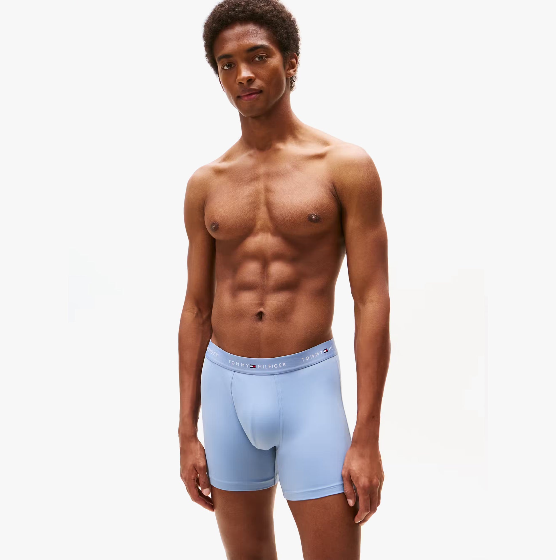 Tommy Hilfiger Mens Signature Microfibre 3 Pack Boxer Briefs Blue Multi front view on model, showcasing soft fabric and fit.