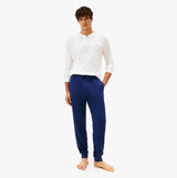 Tommy Hilfiger WAFFLE PANT Mens Cuffed Joggers Navy front view on model wearing a white top.