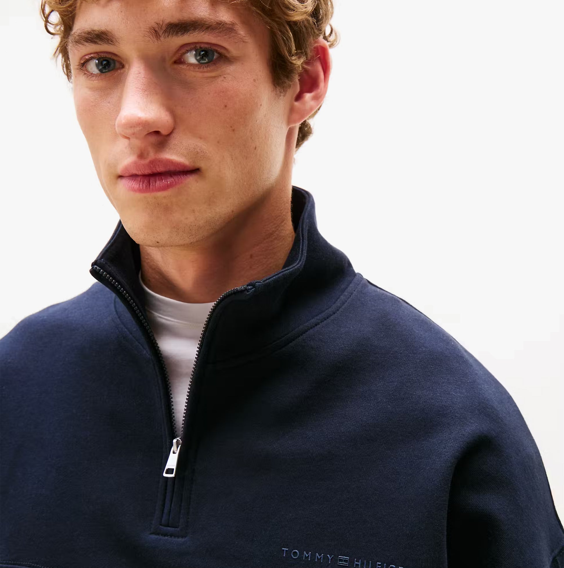 Tommy Hilfiger HALF ZIP Mens Sweatshirts Desert Sky front view featuring model wearing the sweatshirt.