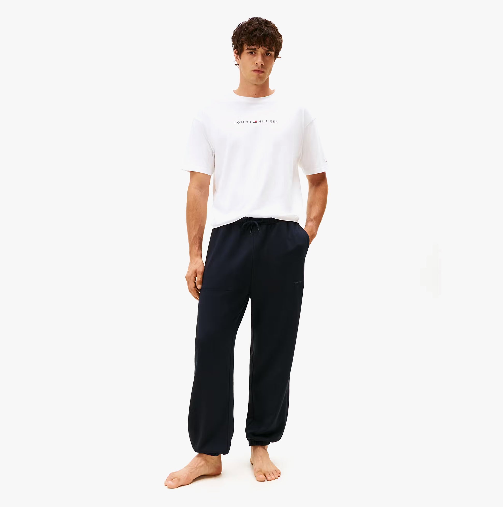 Tommy Hilfiger TRACK PANT Mens Desert Sky front view, model wearing navy pants, casual style