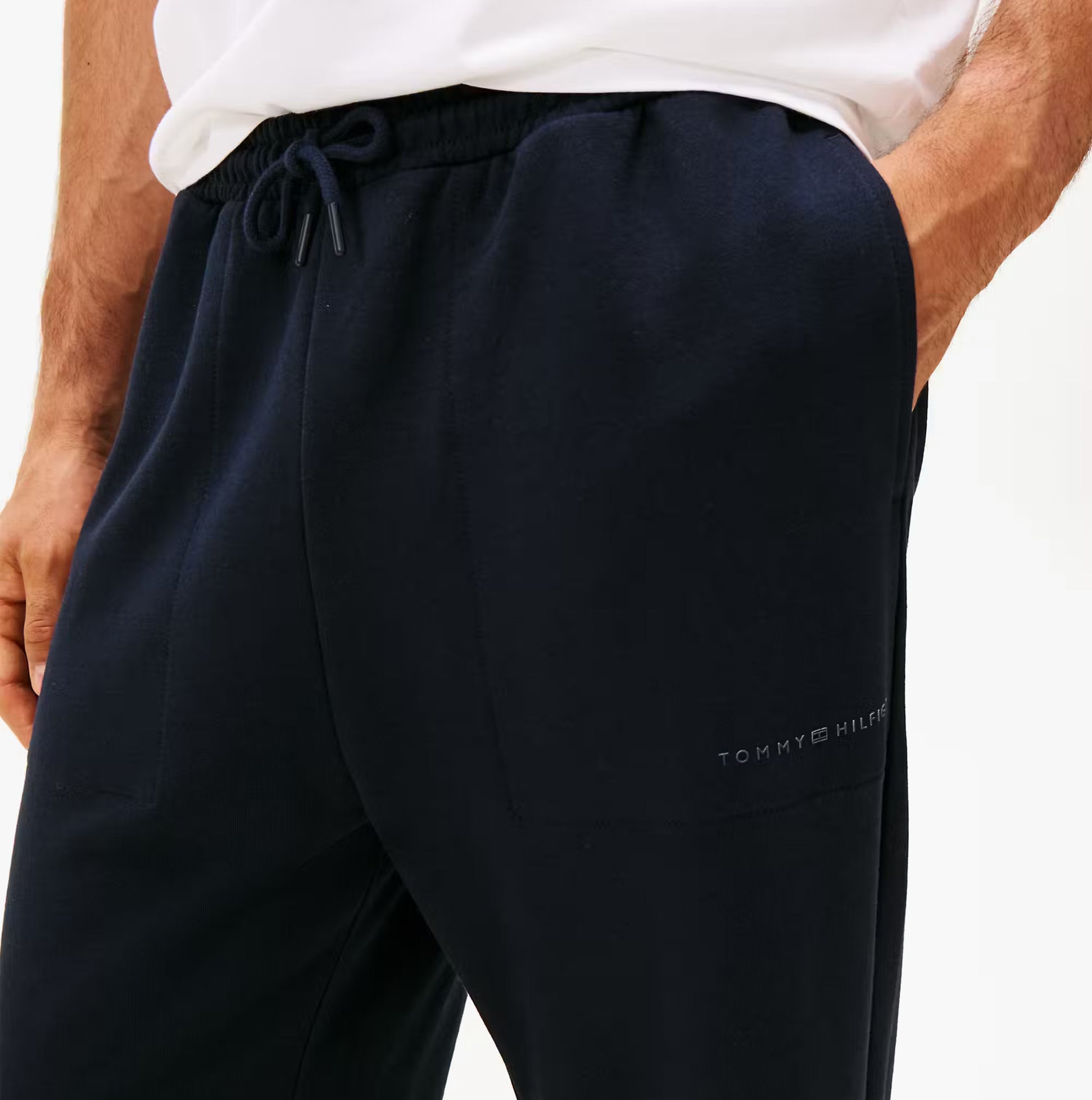 Tommy Hilfiger TRACK PANT Mens Desert Sky detail view showcasing fabric texture and logo.