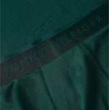 Tommy Hilfiger Mens Boxer Briefs & T-Shirt Green close-up view of waistband with logo detail on dark green fabric.