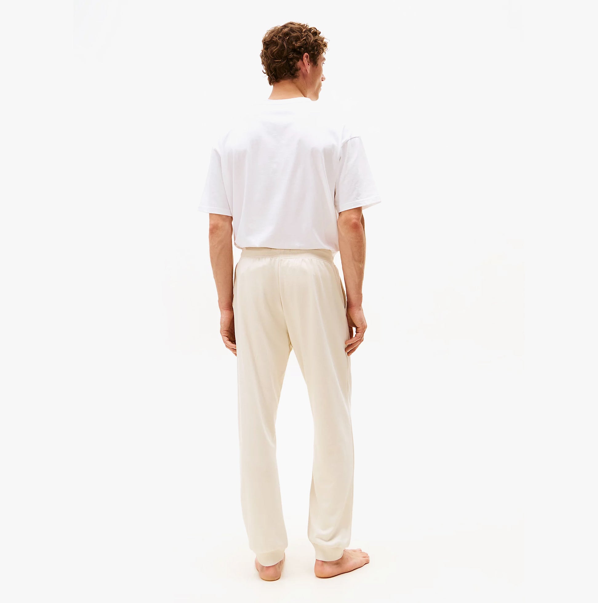 Tommy Hilfiger TH Original Mens Logo Lounge Joggers Off White Newsprint back view on model.
