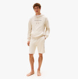 Tommy Hilfiger HOODIE Mens Drawstring Lounge Hoody Off White front view on model, wearing matching shorts, stylish casual outfit.