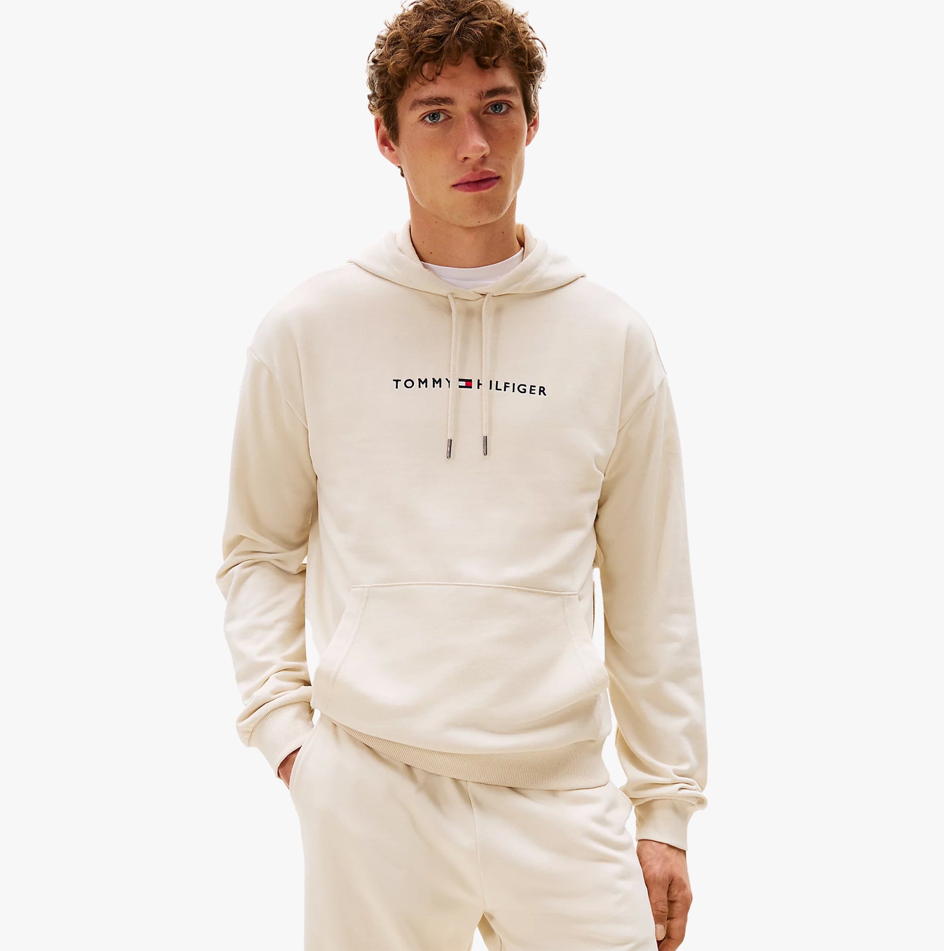 Tommy Hilfiger HOODIE Mens Drawstring Lounge Hoody Off White front view with model wearing it.