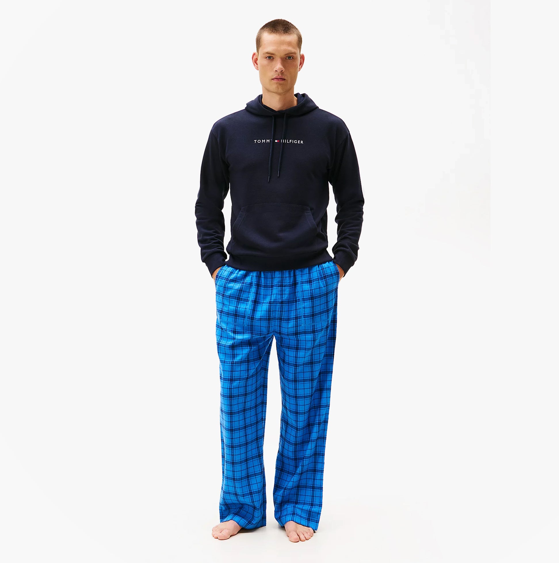 Tommy Hilfiger TH Original Logo Drawstring Lounge Hoodie Desert Sky front view on model with blue plaid pants.