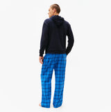 Tommy Hilfiger TH Original Logo Drawstring Lounge Hoodie Desert Sky back view on model wearing blue plaid pants.