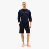 Tommy Hilfiger TRACK TOP Mens Sweatshirts Desert Sky front view of model wearing sweatshirt and shorts.