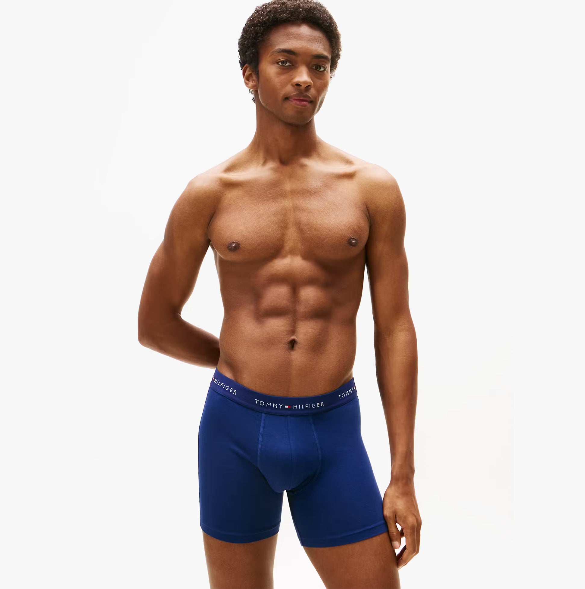 Tommy Hilfiger 3 Pack Mens BOXER BRIEF Multi front view on model wearing navy blue boxer briefs.