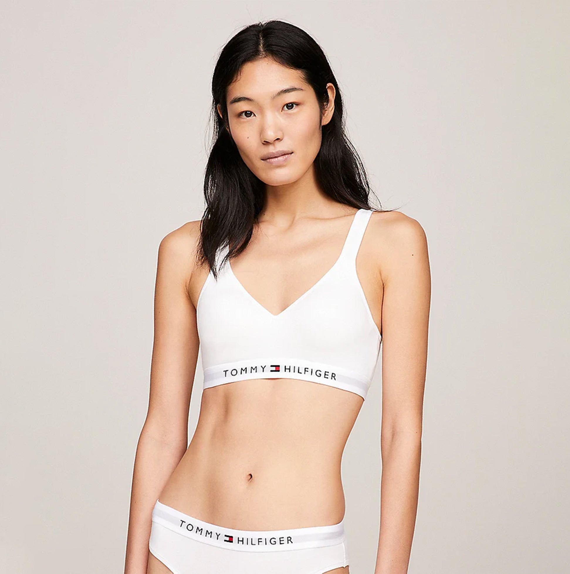 Tommy Hilfiger BRALETTE LIFT Womens White front view showcasing padded, non-wired design with logo band.