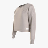Tommy Hilfiger TRACK TOP Womens Track Top Cashmere Creme side view featuring long sleeves and logo detail.