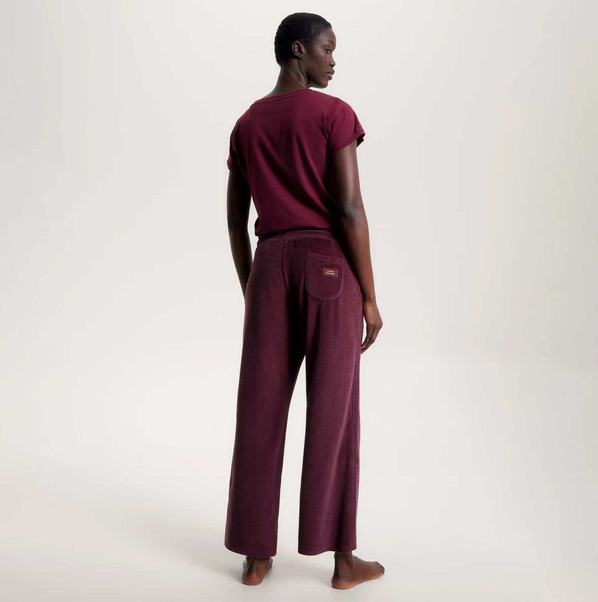 Tommy Hilfiger PANTS VELOUR Womens Pants Deep Burgundy back view model wearing pants.
