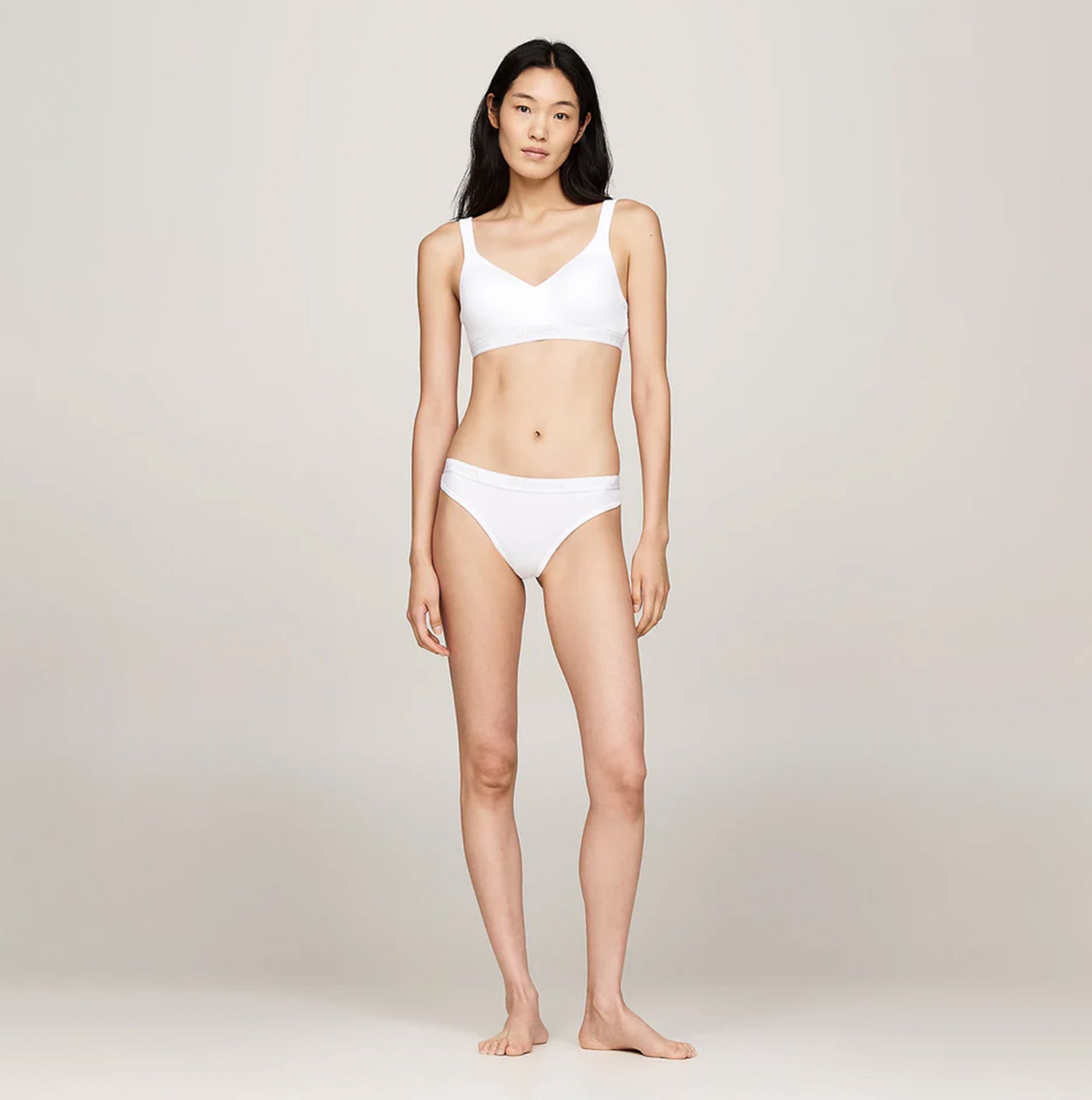 Tommy Hilfiger MONOTYPE Womens Thong White front view with model showcasing a white thong and matching bralette.