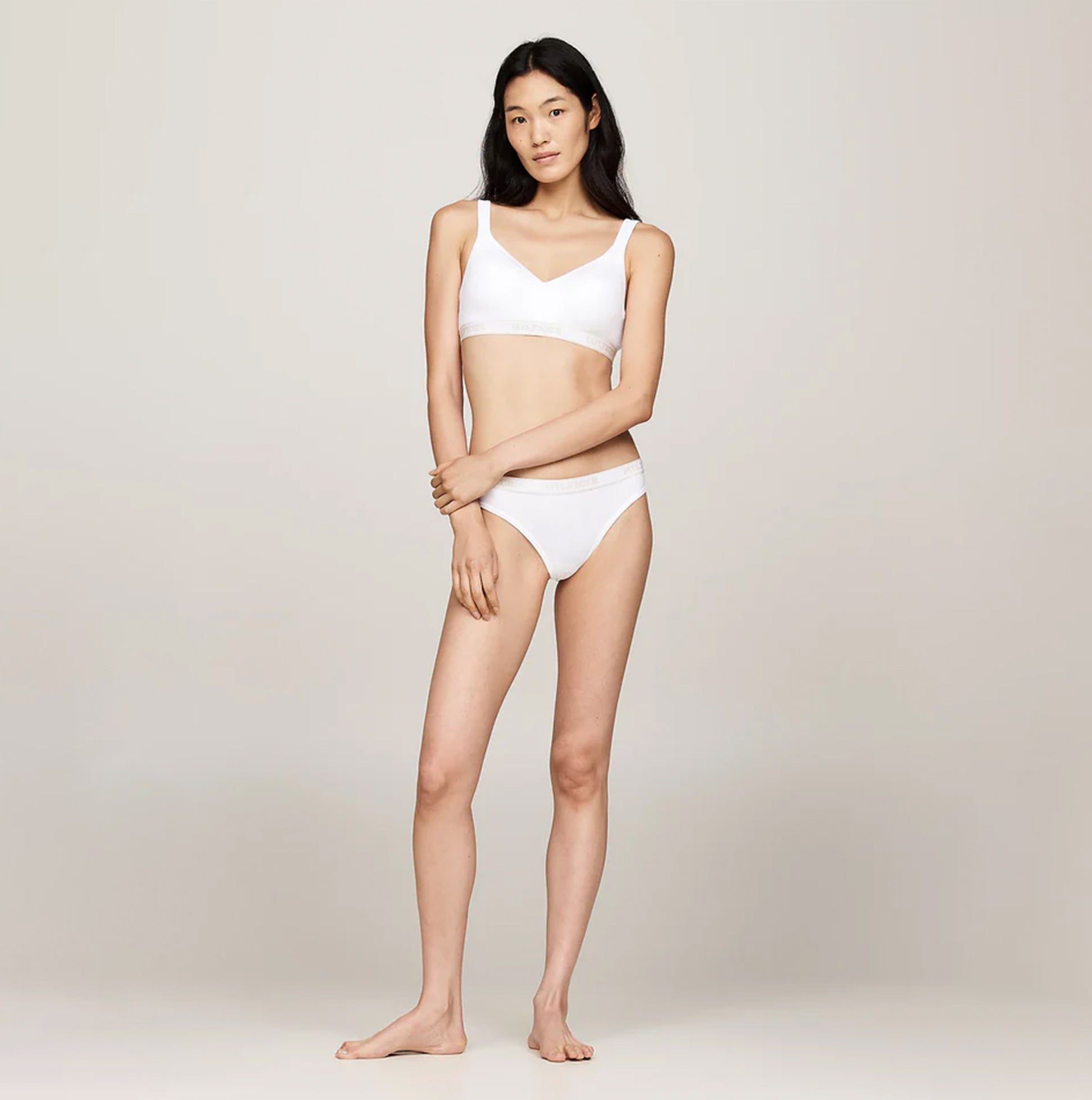 Tommy Hilfiger MONOTYPE Womens Bralette Lifts White front view on model, showcasing the bralette's design and fit.