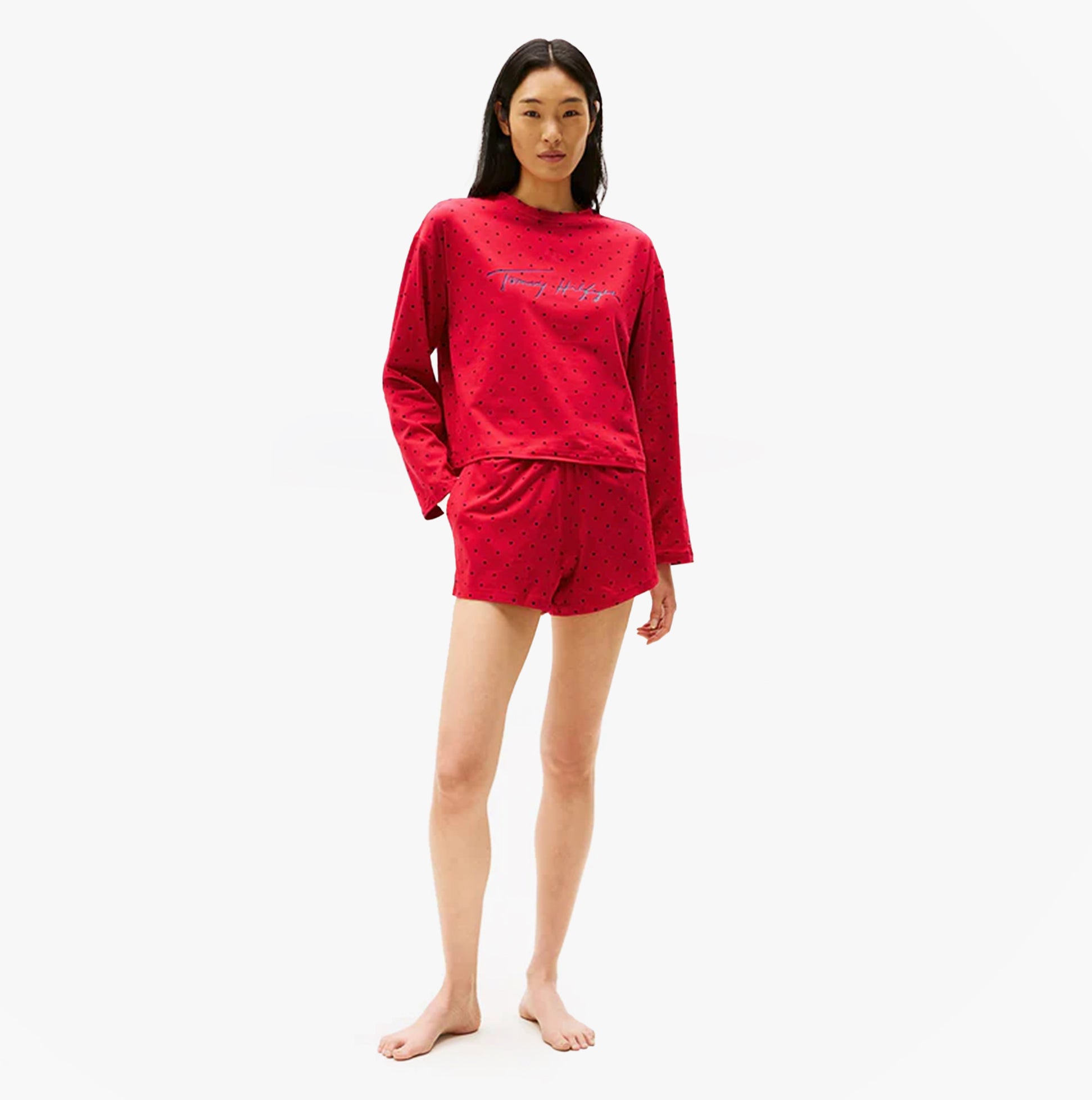 Tommy Hilfiger HERITAGE Womens Pyjama Set Hearts Primary Red Aop front view featuring a model wearing red pyjama set.