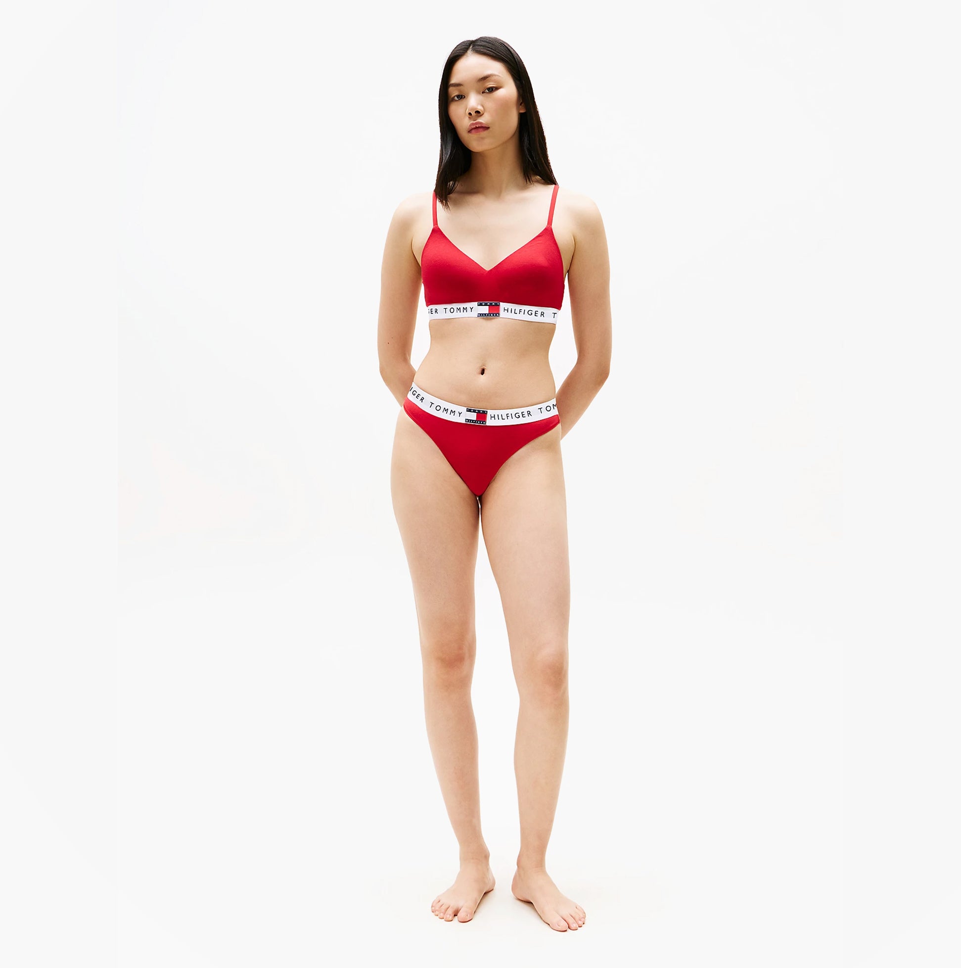 Tommy Hilfiger HERITAGE Womens Padded Push-Up Bralette Primary Red front view on model, featuring adjustable straps and logo underband.