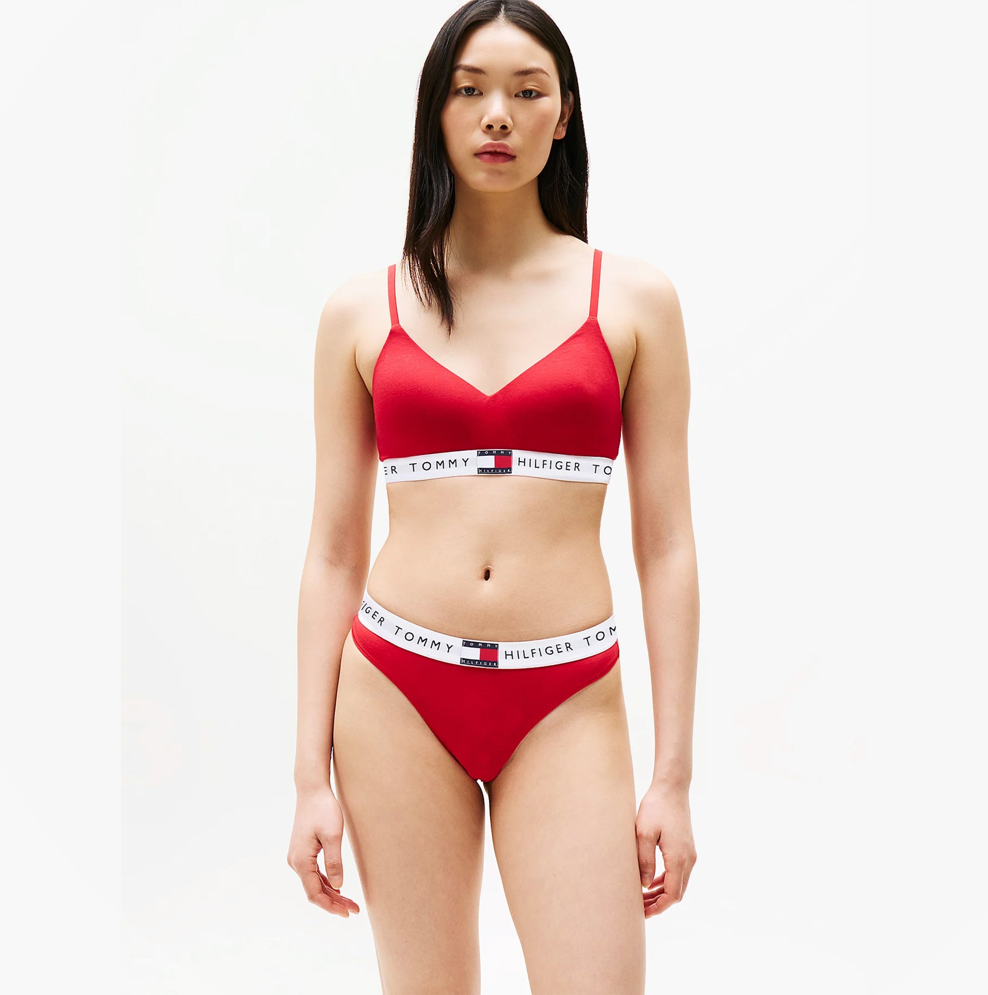 Tommy Hilfiger HERITAGE Womens Padded Push-Up Bralette Primary Red front view on model in matching underwear.