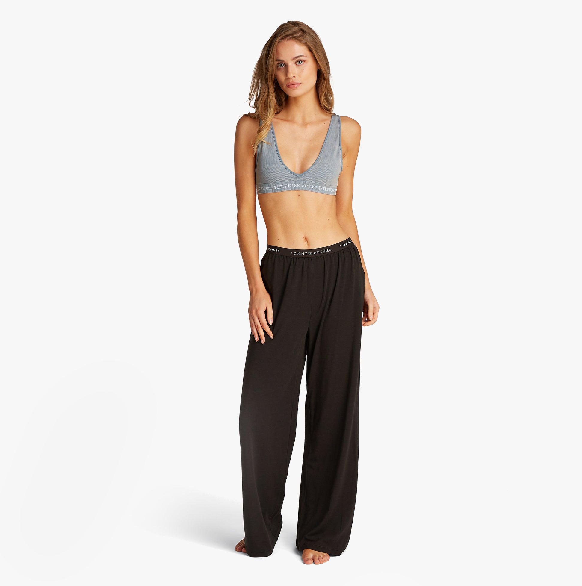 Tommy Hilfiger LOGO Womens Bralette Brisk Blue front view on model wearing black pants.