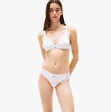 Tommy Hilfiger RIBBED Womens Unlined Triangle Bra White front view model wearing matching underwear.
