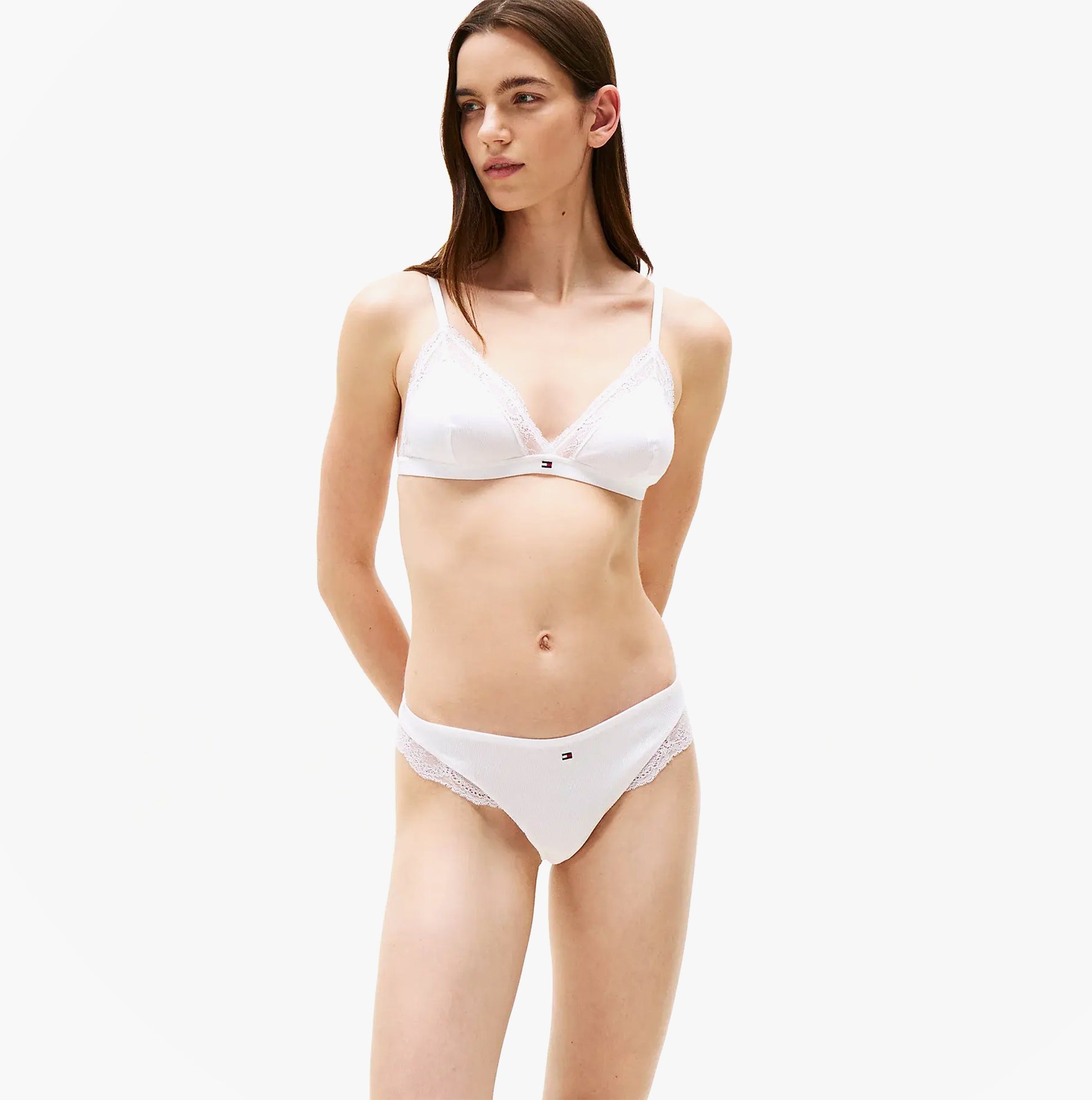 Tommy Hilfiger LACE TRIM Womens Dipped Thong White front view on model, showcasing lace trim and lightweight design.