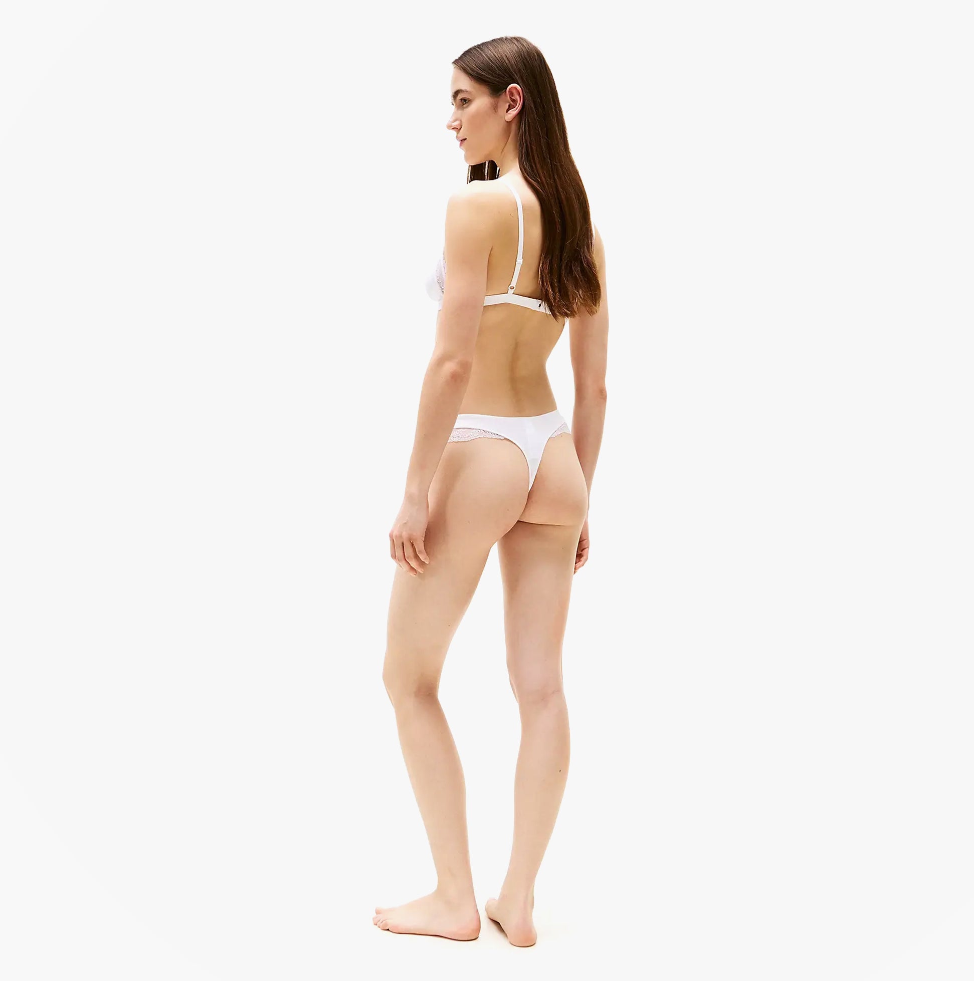 Tommy Hilfiger LACE TRIM Womens Dipped Thong White side view showcasing high-cut leg and lace trim details.