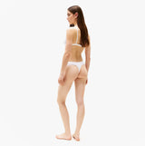 Tommy Hilfiger LACE TRIM Womens Dipped Thong White side view showcasing high-cut leg and lace trim details.
