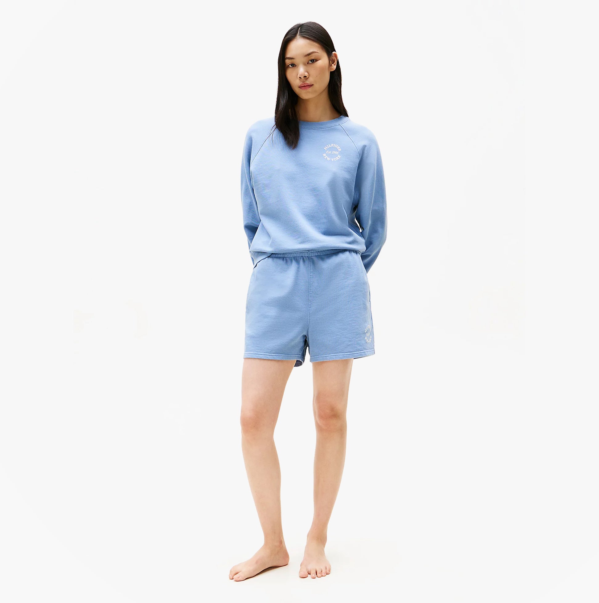 Tommy Hilfiger LOGO Relaxed Womens Lounge Shorts Brisk Blue front view, model showcasing comfort and lightweight design.