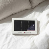 Tommy Hilfiger 3 PACK LACE Womens Thong Black in gift box view on bed with light bedding.