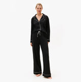 Tommy Hilfiger SHIRT PANTS SET Womens Set Black, front view of relaxed fit long sleeve shirt and pants set.