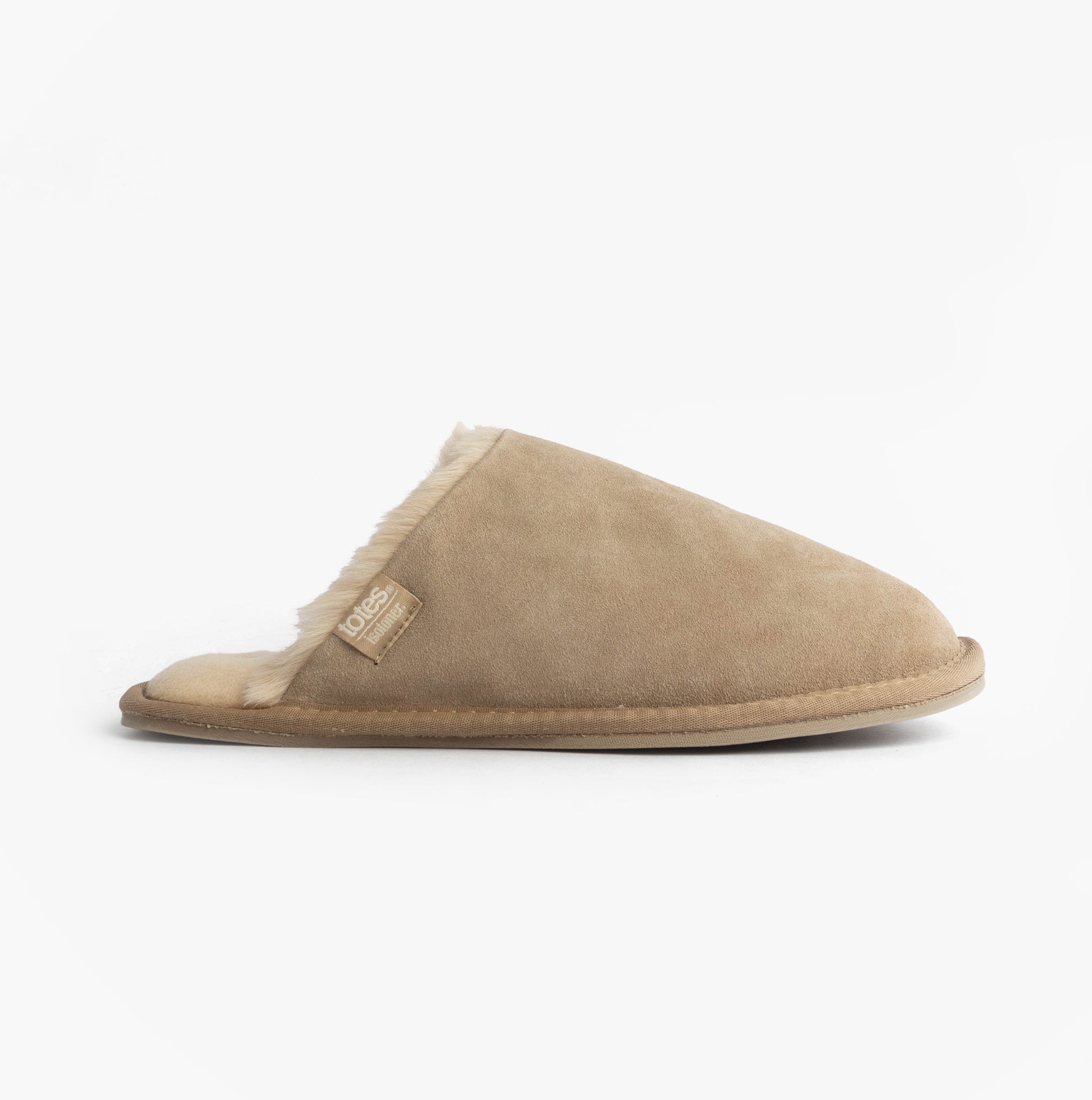 Totes Isotoner REAL SUEDE MULE Womens Slippers Sand side view showing the slip-on design and suede material.