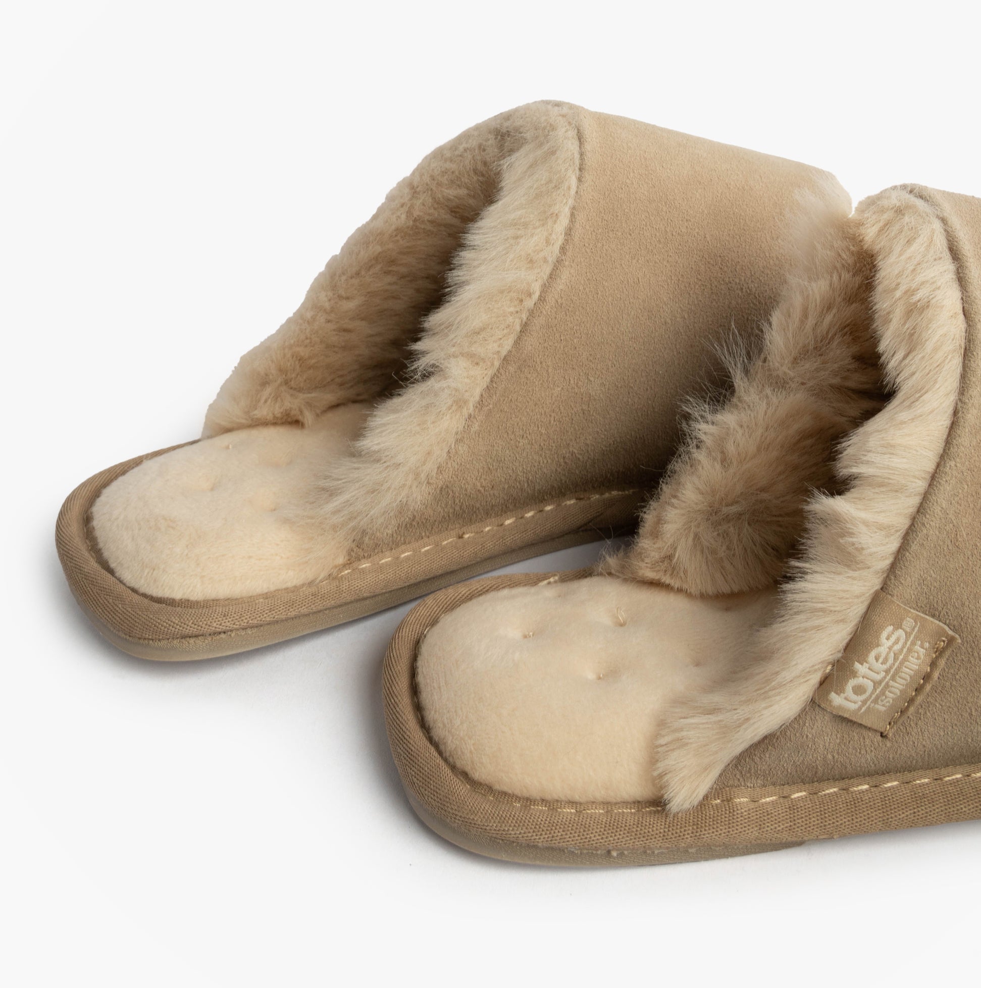 Totes Isotoner REAL SUEDE MULE Womens Slippers Sand side view with warm lining and soft suede material.