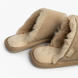 Totes Isotoner REAL SUEDE MULE Womens Slippers Sand side view with warm lining and soft suede material.