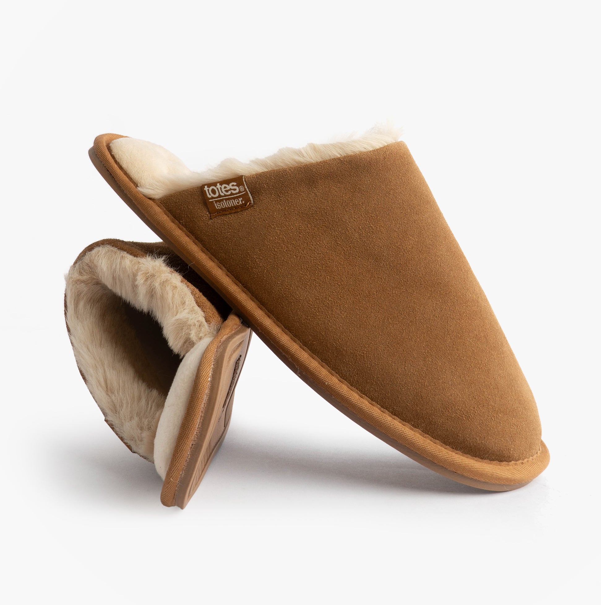 Totes Isotoner REAL SUEDE MULE Womens Slippers Tan side view, showcasing soft suede and warm lining.
