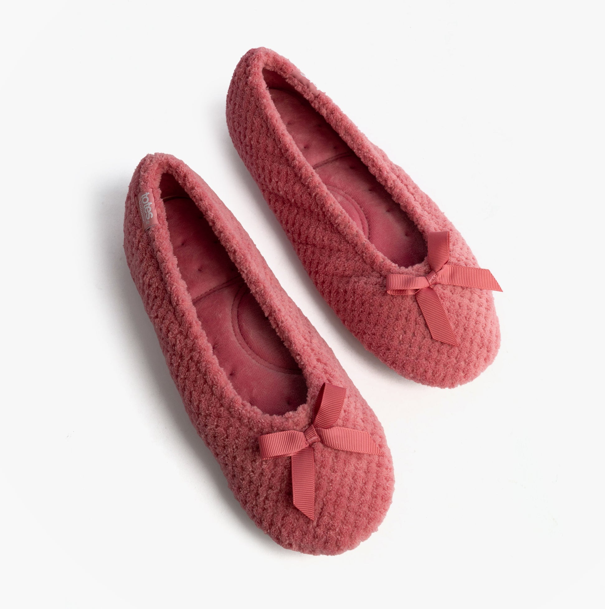 Totes Isotoner POPCORN BALLET Womens Ballerina Slippers Bright Pink top view with bows, soft texture and cozy design.