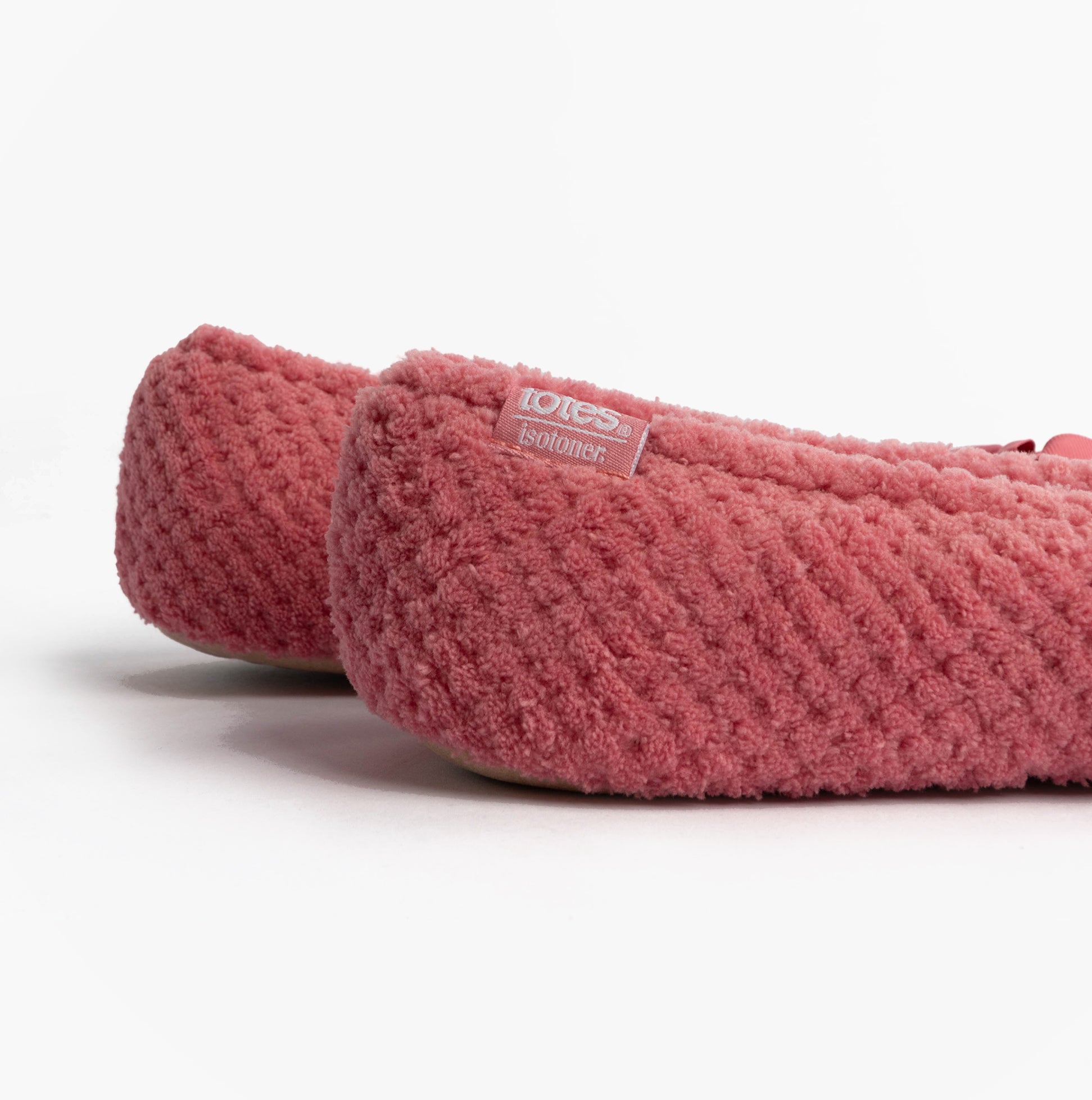 Totes Isotoner POPCORN BALLET Womens Ballerina Slippers Bright Pink side view showing textured upper and logo detail.