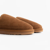Totes Isotoner REAL SUEDE FULL BACK Mens Full Back Slippers Tan side view showcasing soft suede upper and round toe shape.
