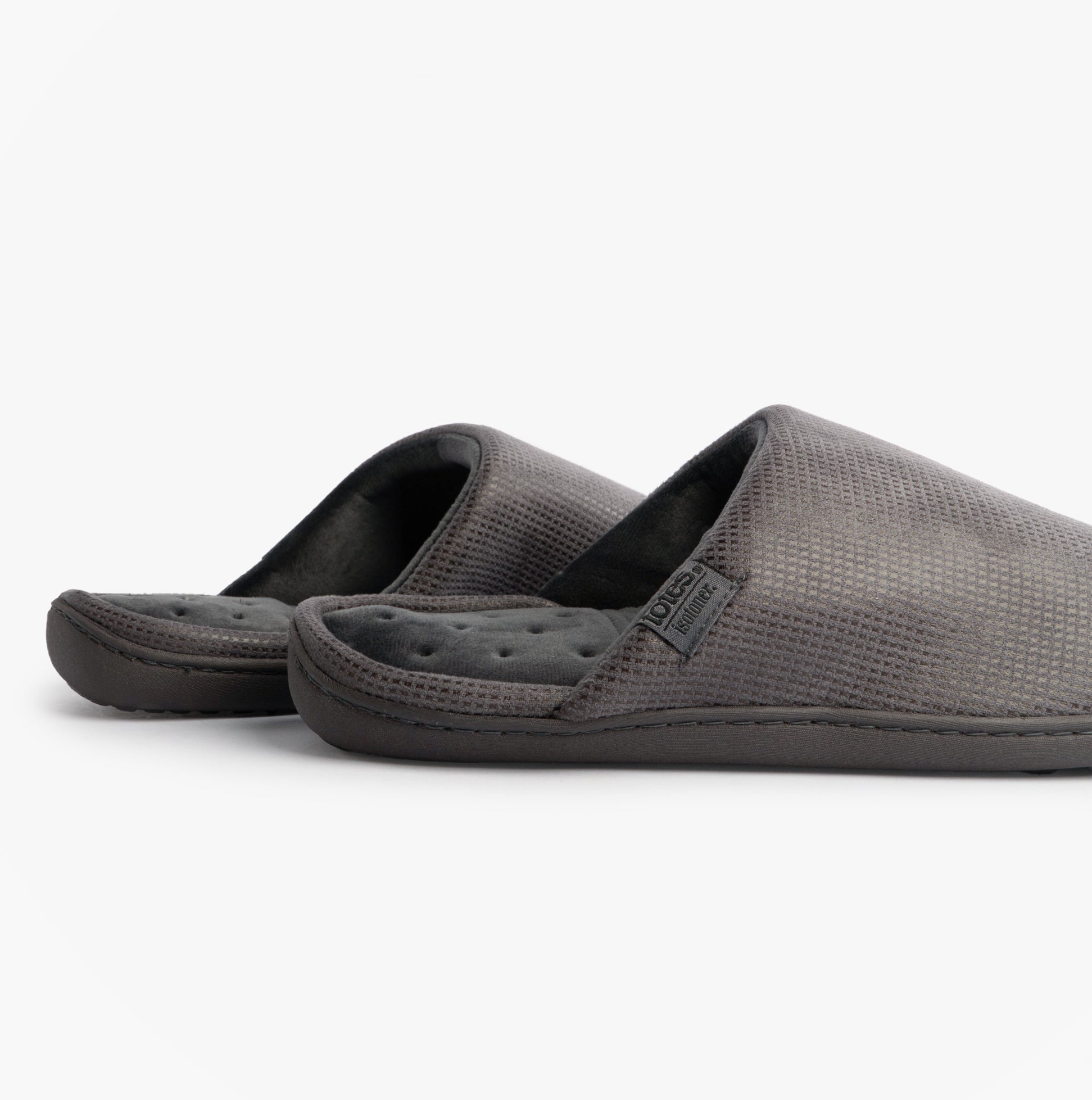 Totes Isotoner SQUARE PATTERNED SMART MULE Mens Mule Slippers Grey side view featuring slip-on design and padded footbed.