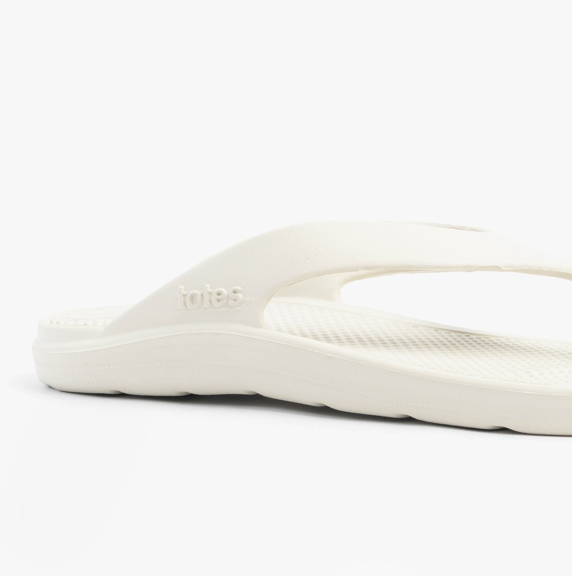 Totes Sol Bounce 0350JSTN Womens Toe Post Sandals Stone side view showcasing synthetic upper and comfortable sole.