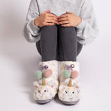 Totes Toasties MULTI FAUX FUR BOOT Slippers Kids Multi front view on a child, showcasing colorful unicorn design with pom-poms.