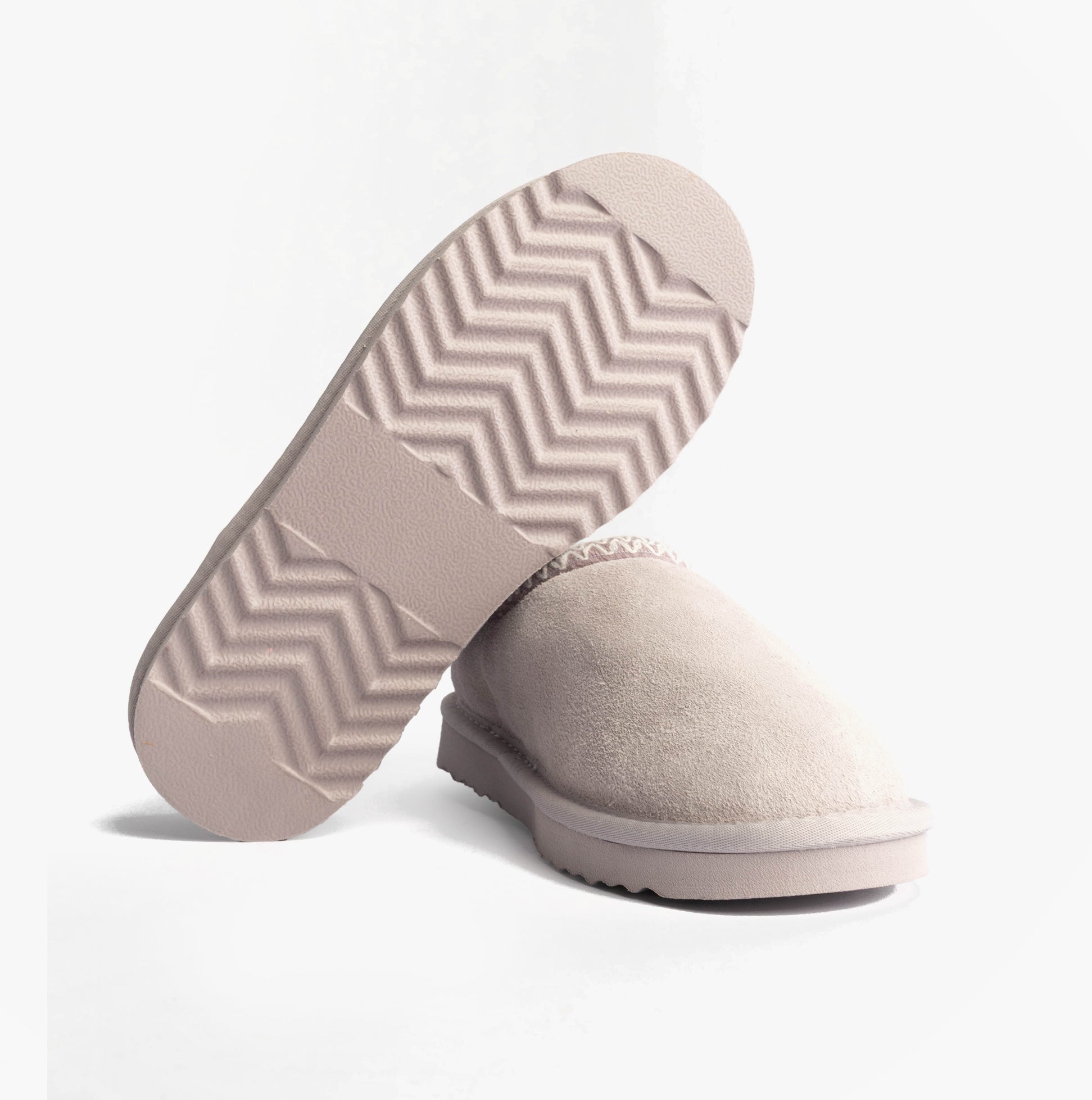 Totes Toasties ICONS SUEDE Shoot Slippers Womens Lilac bottom view highlighting outsole design.