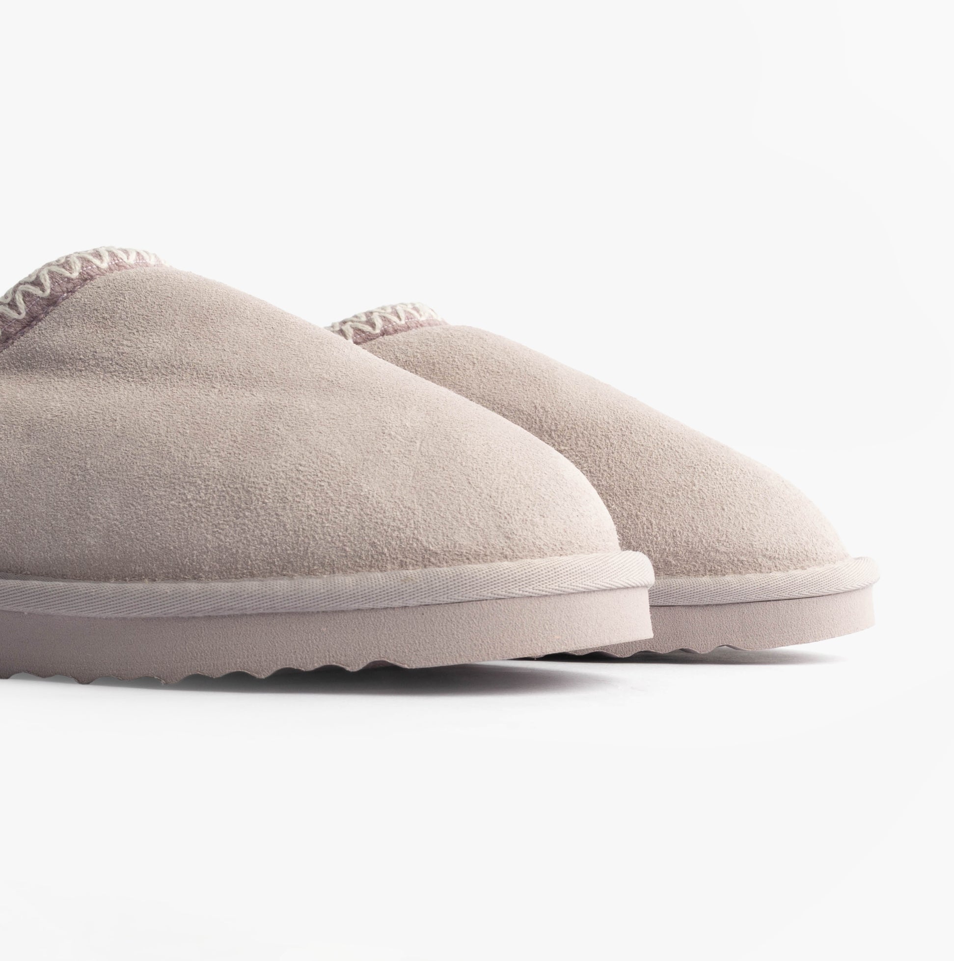 Totes Toasties ICONS SUEDE Shoot Slippers Womens Lilac side view of suede slippers showcasing round toe and slip-on design.