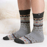 Totes Toasties ORIGINAL NOVELTY SLIPPER SOCKS Mens Socks Fairisle side view on feet, showing patterned design and comfortable fit.