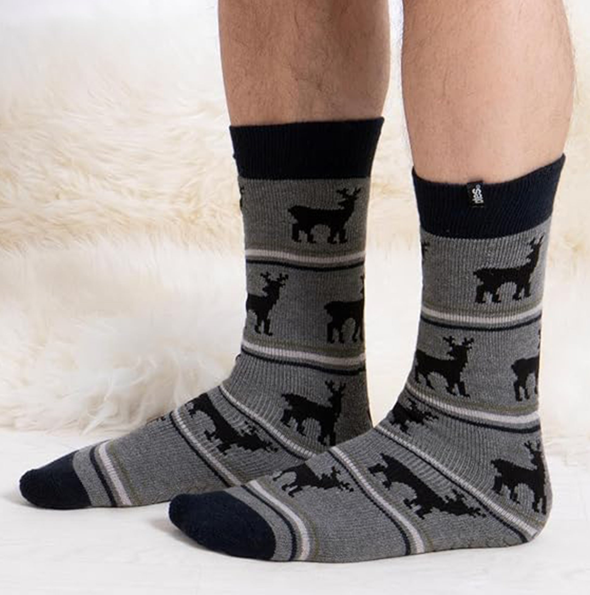 Totes Toasties ORIGINAL NOVELTY SLIPPER SOCKS Mens Socks Stag side view showing grey socks with stag design and slip-resistant tread.