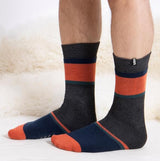 Totes Toasties ORIGINAL SLIPPER SOCKS (TWIN PACK) Mens Socks Football / Stripe side view on feet with vibrant colors.
