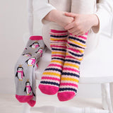 Totes Toasties ORIGINAL Slipper Socks (Twin Pack) Unisex Kids Socks Penguin / Stripe, front view of socks on child's feet.