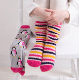 Totes Toasties ORIGINAL Slipper Socks (Twin Pack) Unisex Kids Socks Penguin / Stripe, front view of colorful socks on feet.