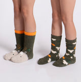 Totes Toasties SUPER SOFT SLIPPER SOCKS (Twin Pack) Unisex Kids Socks Dino/Camo, front view showing two kids wearing socks.